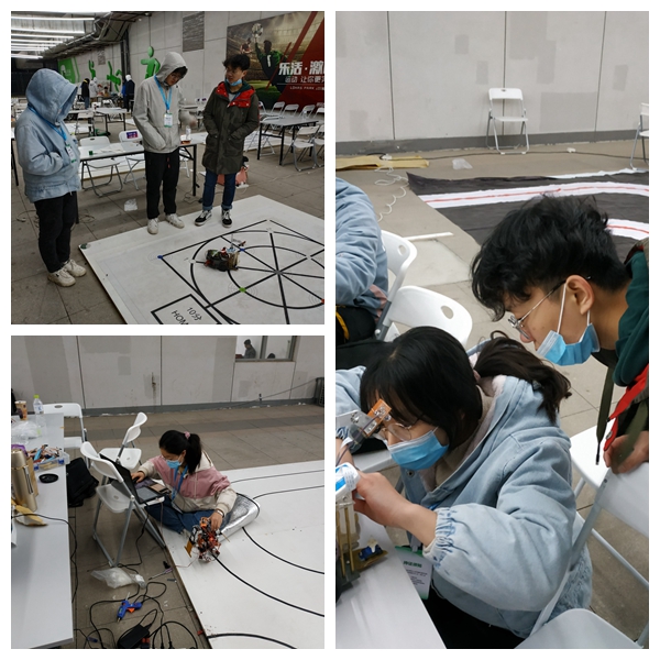 91e77f0b6255451ca8ff97f91514da3c.jpg 中国机器人大赛现场调试.jpg